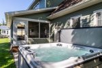 Soak and unwind in the large hot tub 